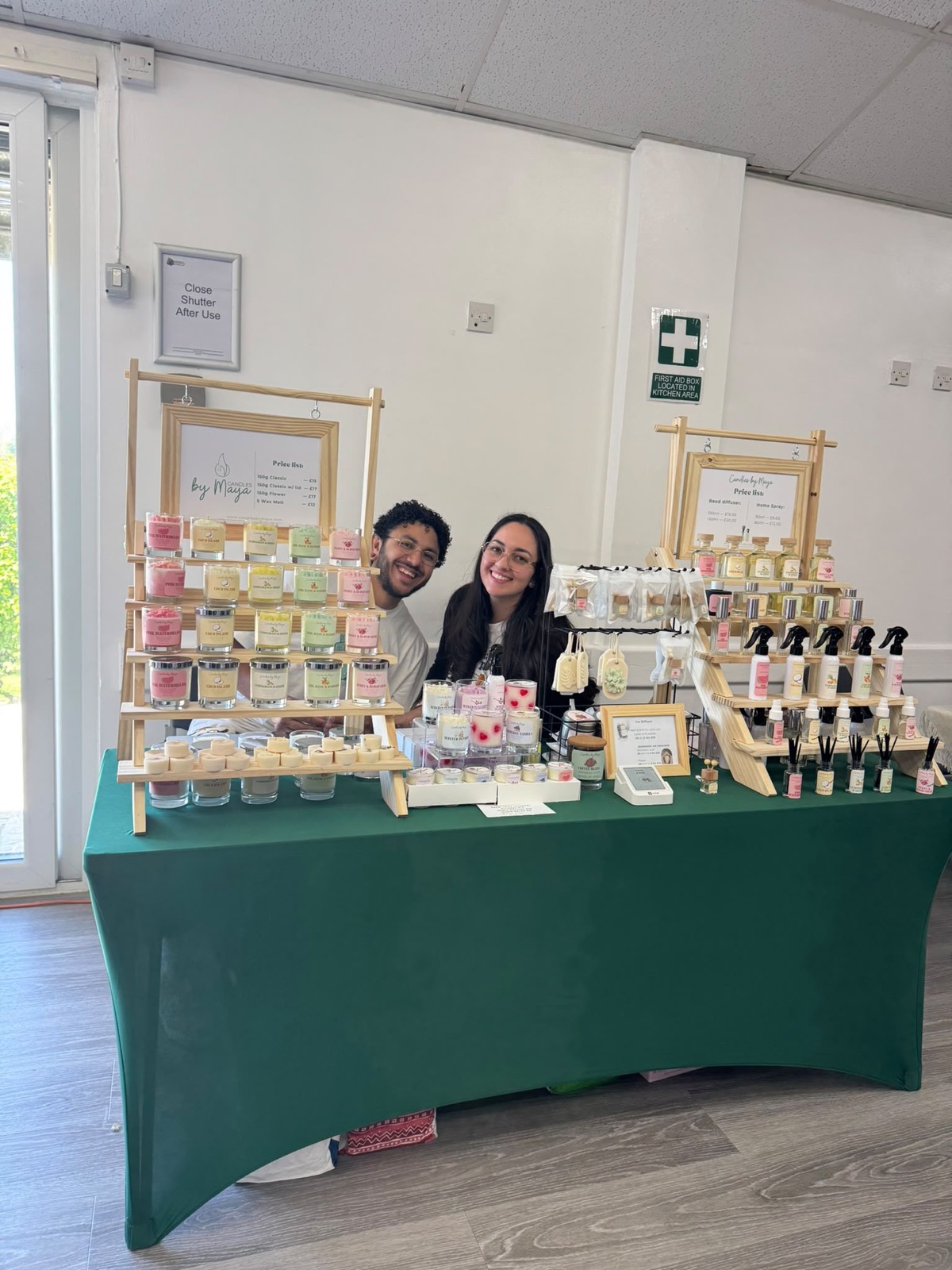 Exhibitors behind their wax melt and soap stall
