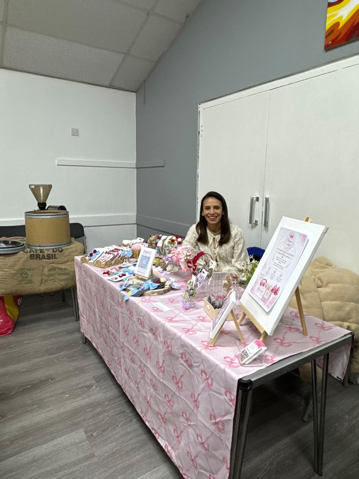 Maker at her craft stall with framed prints